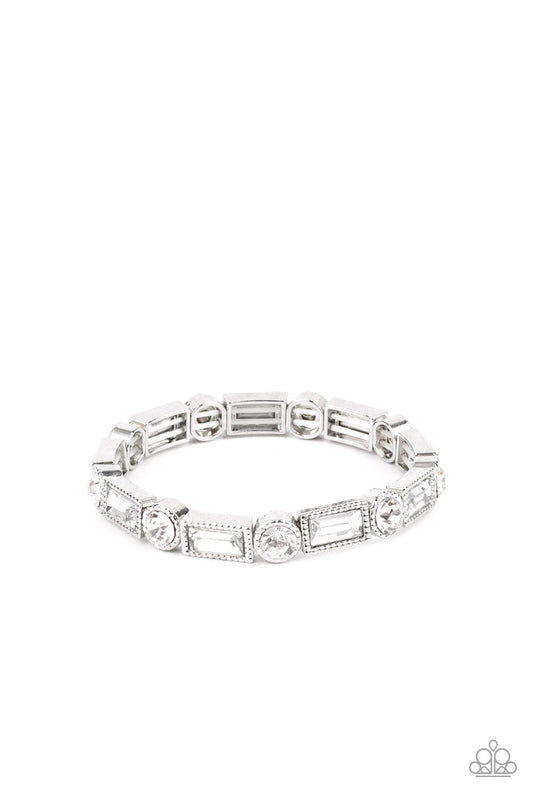 Paparazzi Jewelry Classic Couture - White Bracelet Pusher P Classic round and baguette-cut rhinestones set in shiny dotted silver frames alternate around the wrist on stretchy bands for a shimmering finish. Sold as one individual bracelet.