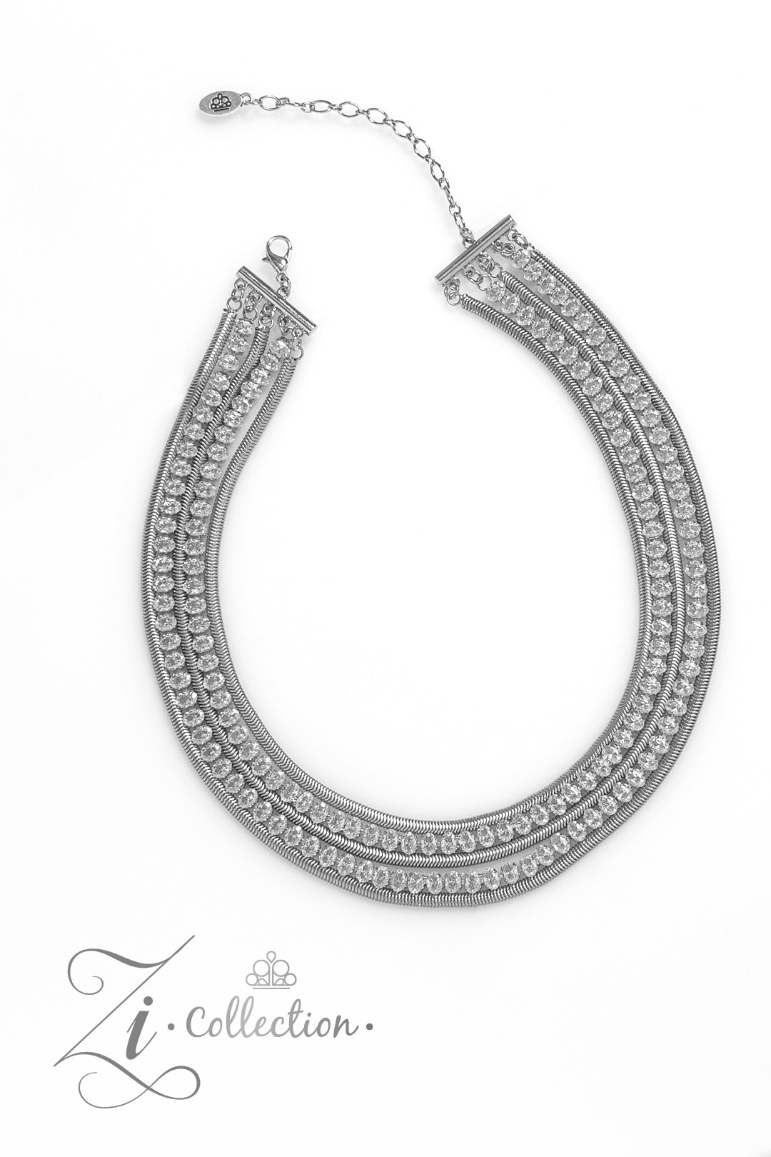 Flat silver snake chains alternate with explosive rows of sparkling white rhinestones in this 2023 Zi Collection piece from Paparazzi Accessories. Features an adjustable clasp closure and includes matching earrings from Pusher P