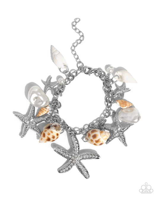 Paparazzi Seashell Song - White Charm Bracelet - A bracelet adorned with a mix of silver starfish, baroque pearls, and delicate seashells.