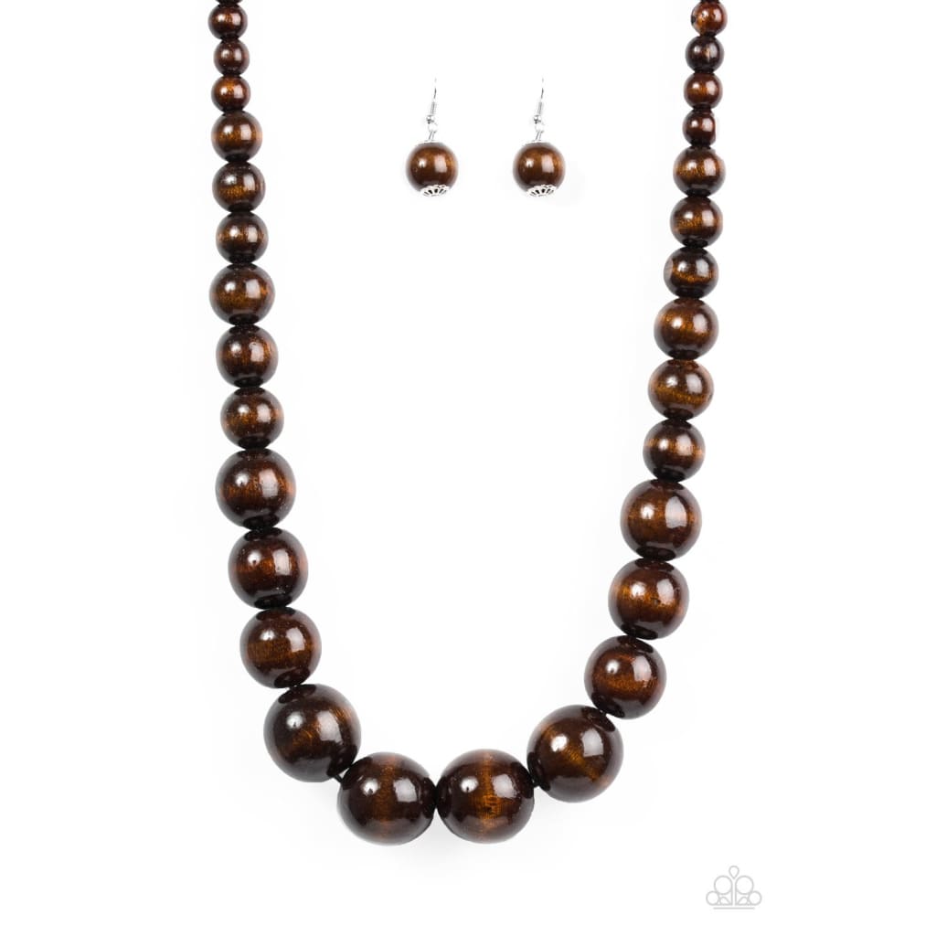 Paparazzi Effortlessly Everglades - Brown Necklace Gradually increasing in size near the center, earthy wooden beads are threaded along a brown string for a summery look. Features an adjustable sliding knot closure. Sold as one individual necklace. Includes one pair of matching earrings. Paparazzi Accessories are all Lead Free and Nickel Free